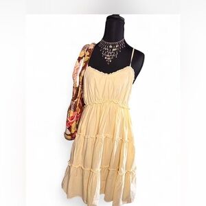 Elegant Pastel Yellow Spaghetti Strap Dress with Ruffled Tiers & Smocked Back